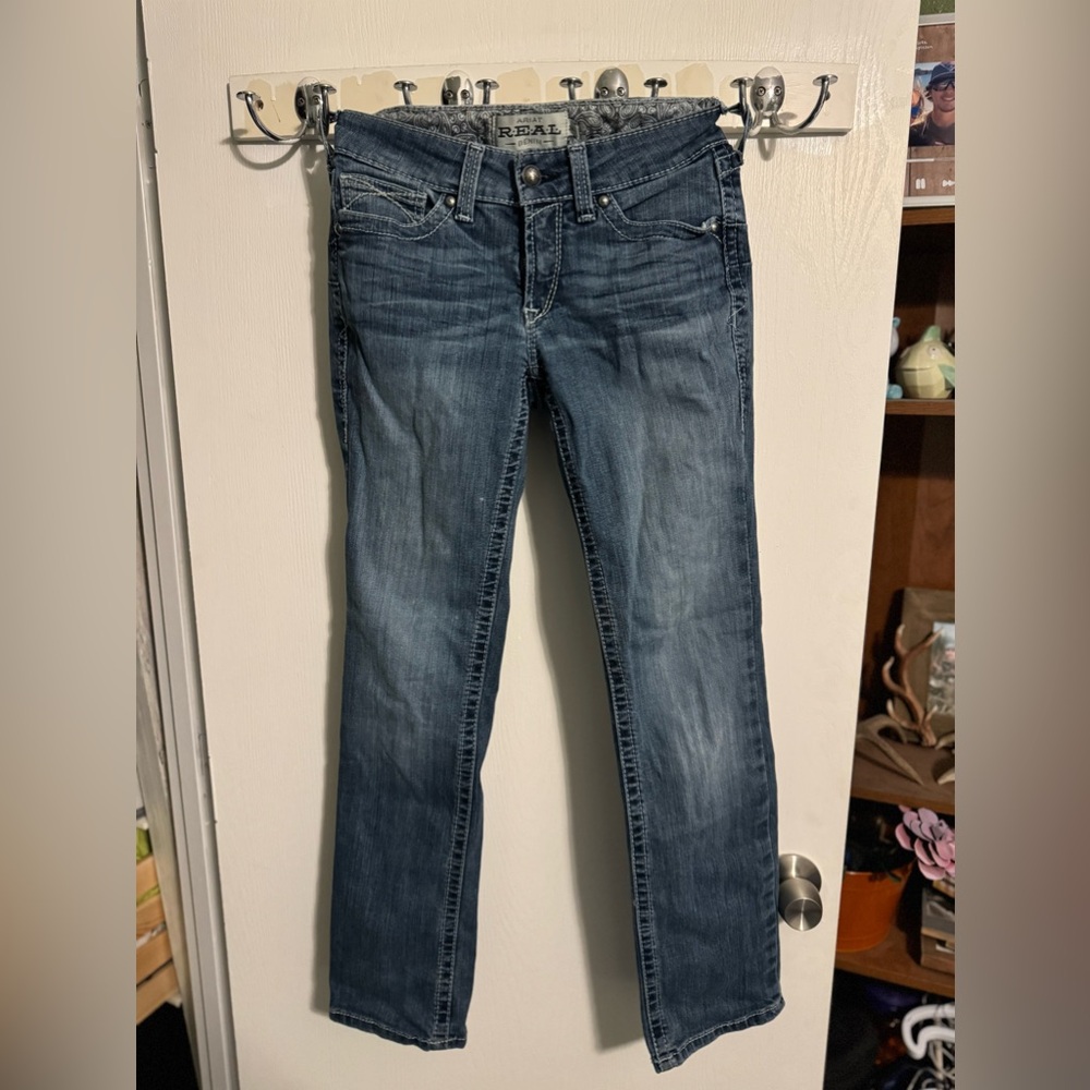 Great condition Ariat R.E.A.L. slim boot cut jeans. 26 Short. Mid rise